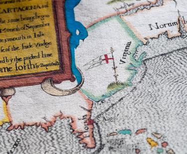 Detail of a colored, engraved map shows "Florida," "Virginia," and partial view of frontispiece with text in English.