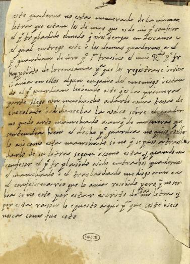 manuscript Spanish text stained with chocolate beverage