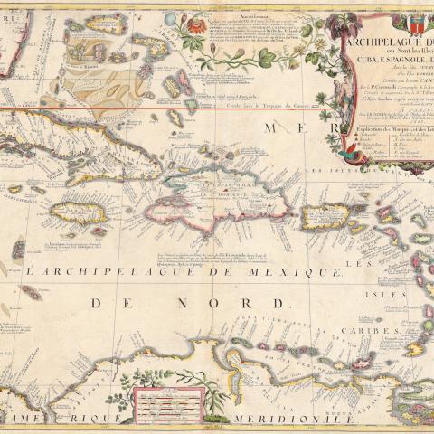 colorful map of Caribbean islands with decorative cartouche